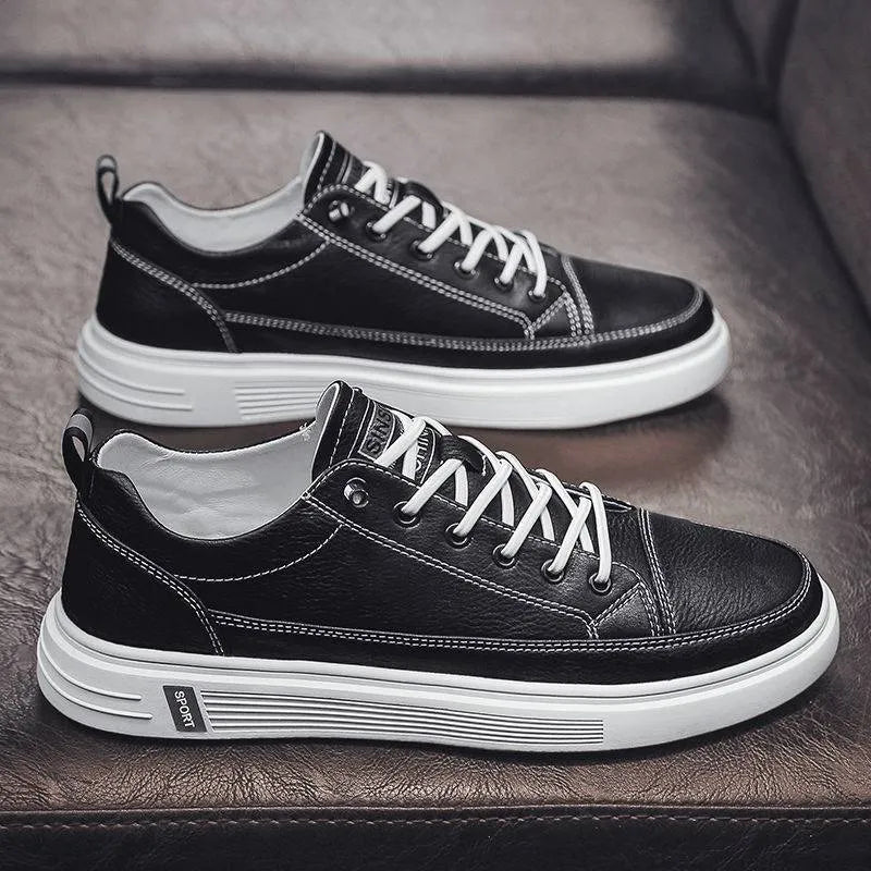 Men's white casual shoes with round toe, flat bottom, and shallow opening design