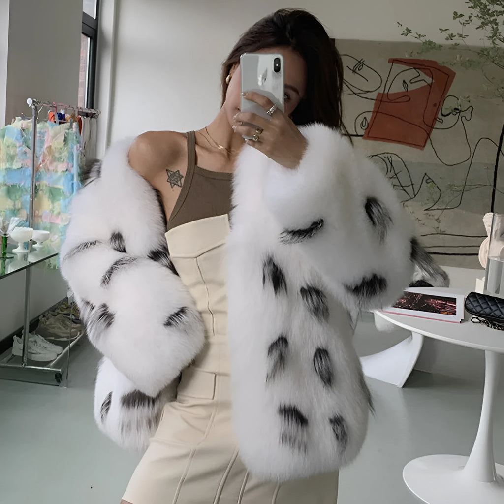 Black and white women's plus size slim-fit faux fur coat with short length and regular sleeves.