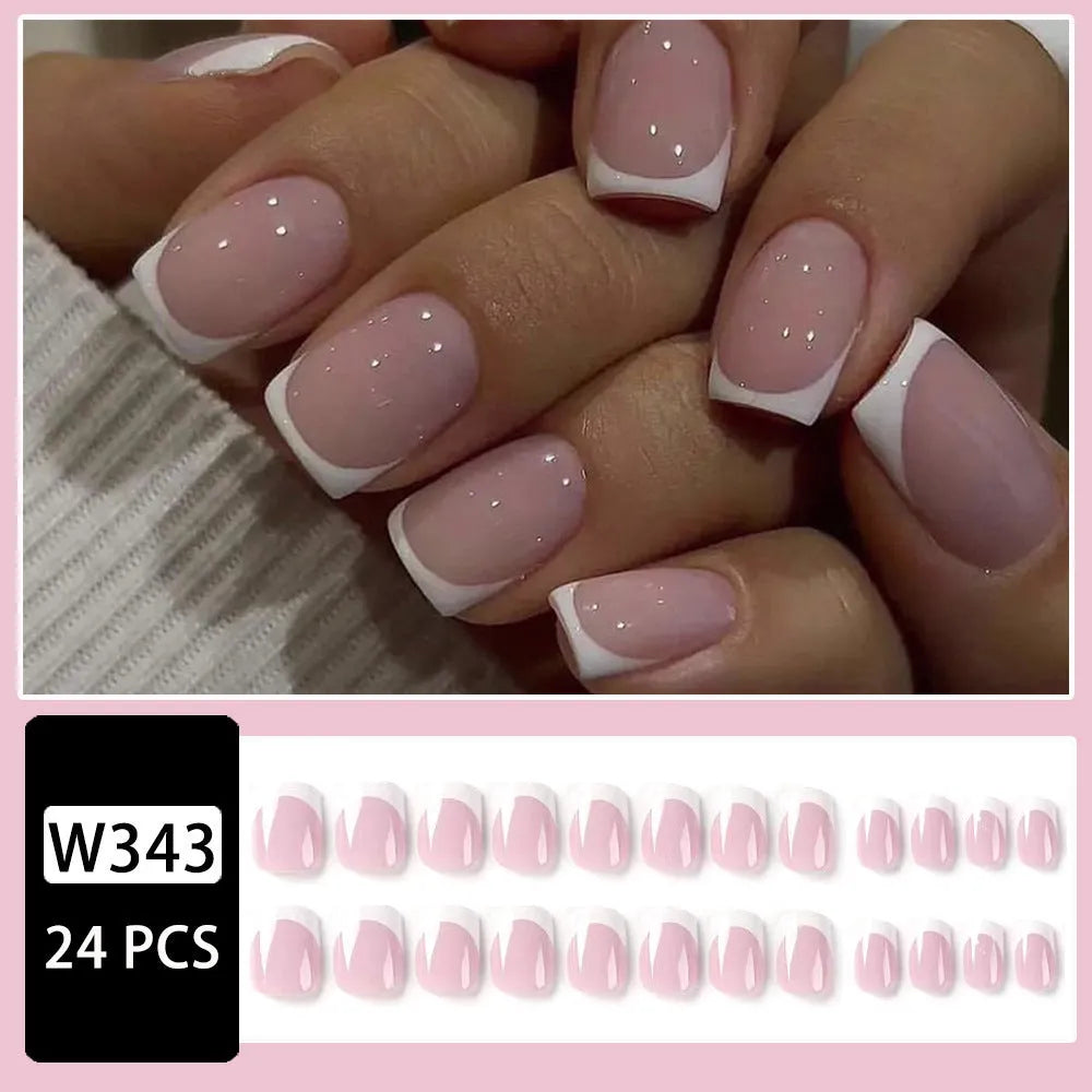 24 white false nail tips with a plaid pattern, laid out on a surface