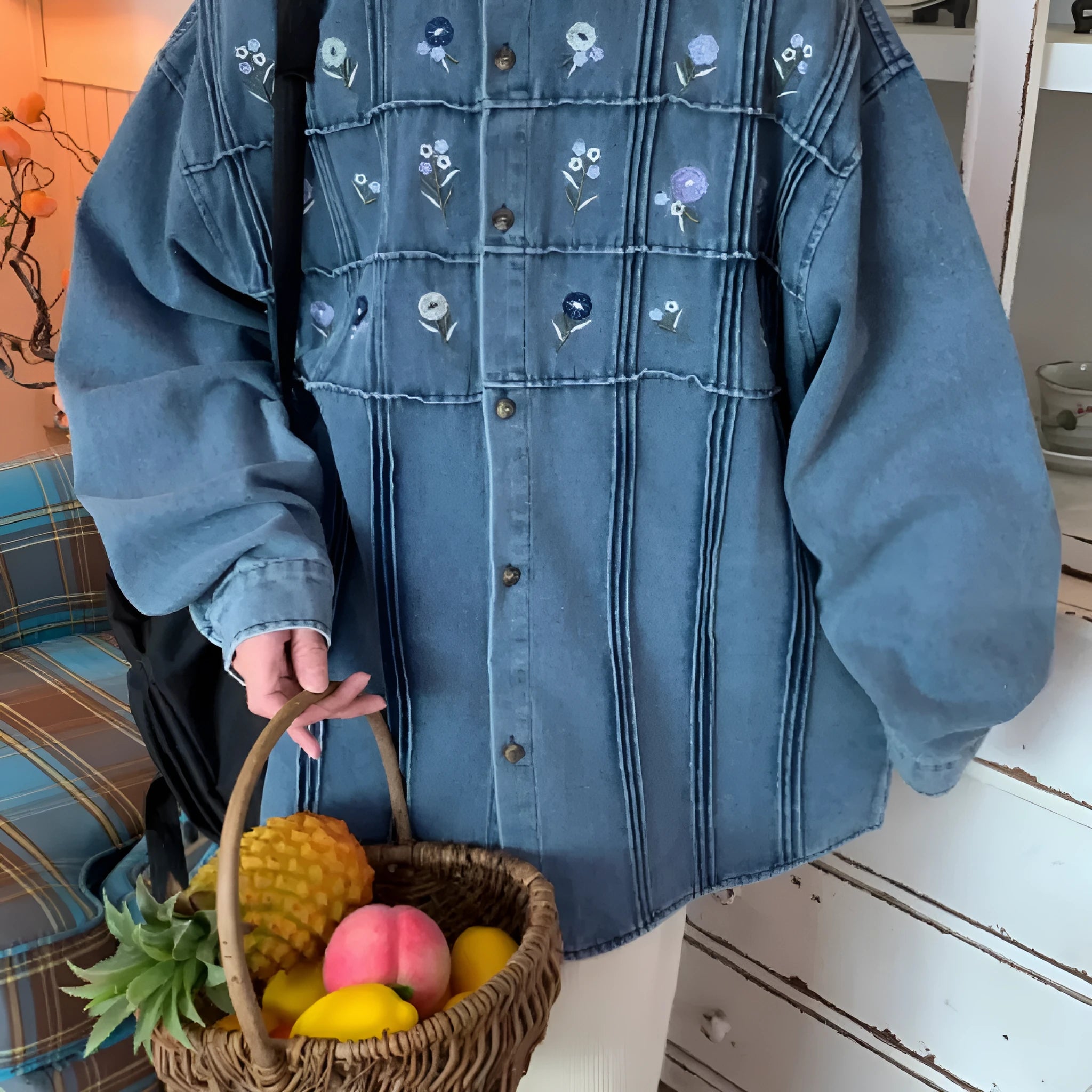 Washed blue denim long sleeve shirt with vintage small floral pleat details on the front.