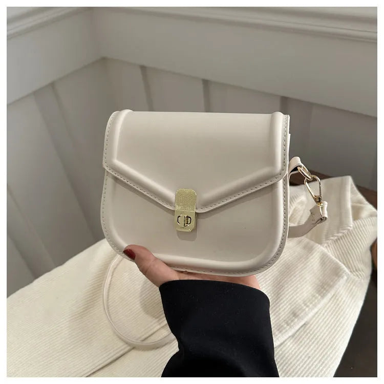 Soft PU shoulder messenger bag in horizontal square clamshell shape with niche texture.