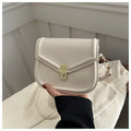 Soft PU shoulder messenger bag in horizontal square clamshell shape with niche texture.
