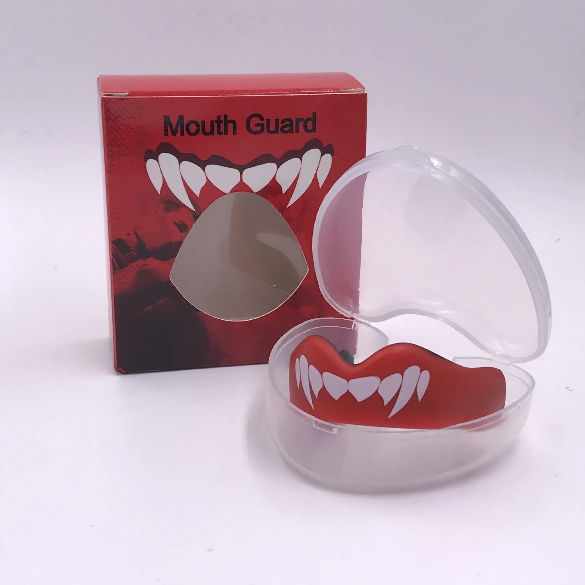 Adult boxing mouthguard with printed teeth design in black and white, for martial arts protection.