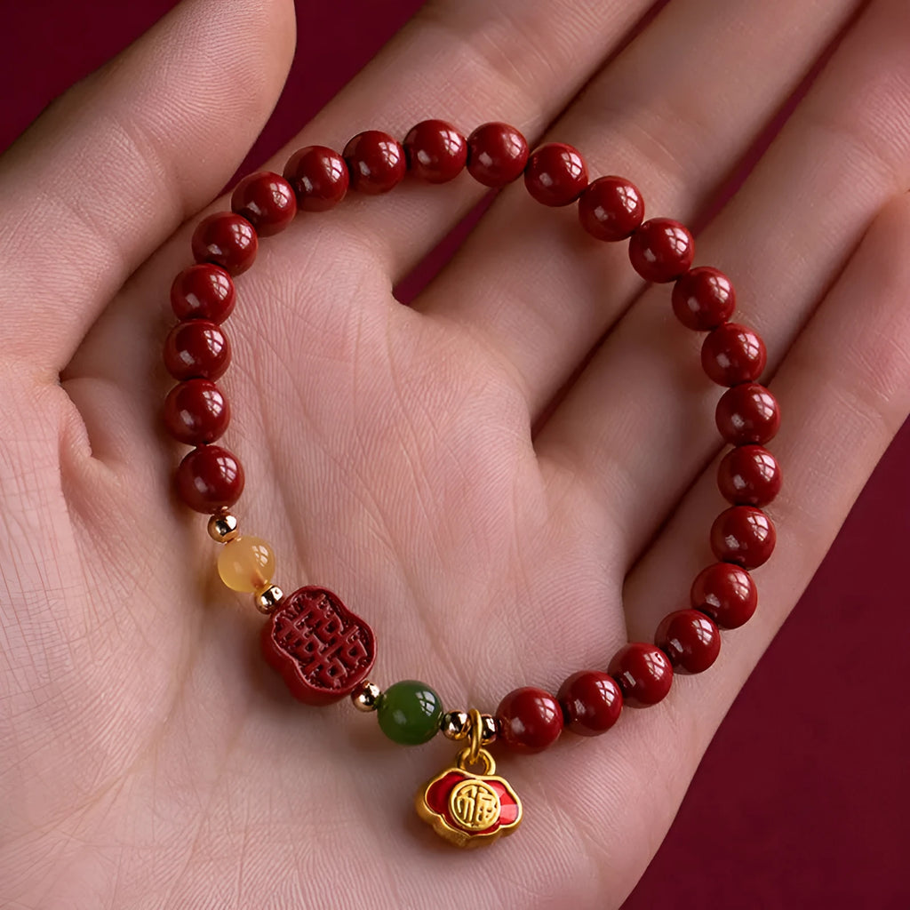 Cinnabar bracelet with raw emperor sandstone beads and a fu character charm in new Chinese style.