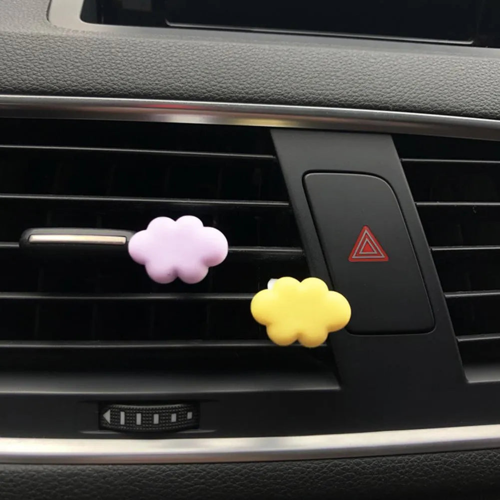 Resin car fragrance clip with Baiyun Cartoon design attached to car air vent