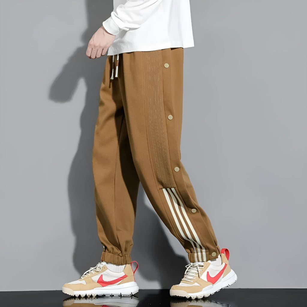 Men's loose fit cotton blend sports pants with high waist and ankle-tied cuffs in solid colours