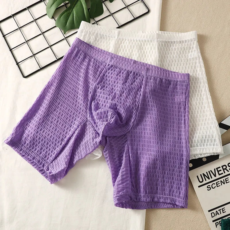 Men's lace boxer underwear in light purple on a grey background, showing the lengthened hip lift design.