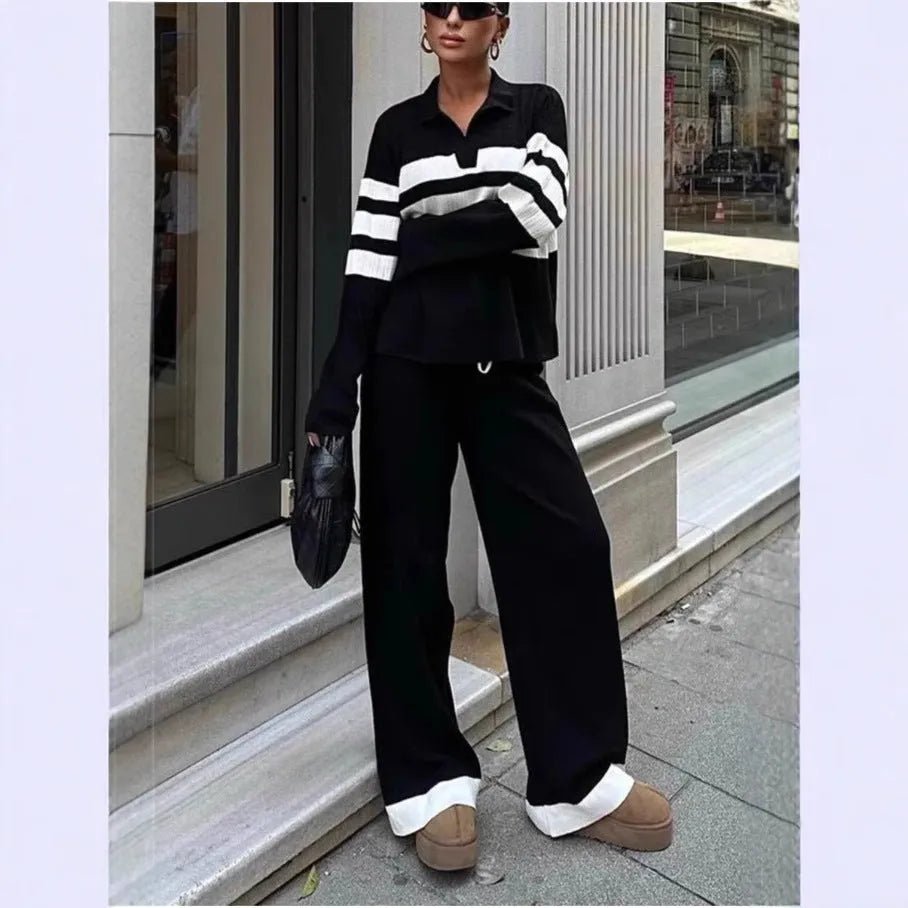 Women's black knitted two-piece set with polo collar shirt and striped matching trousers