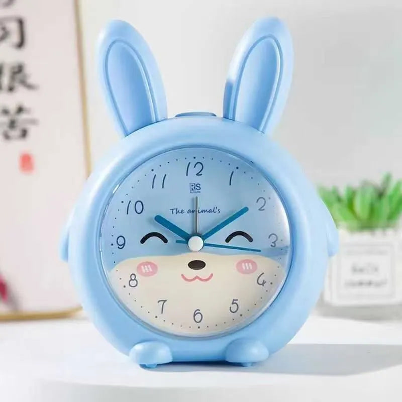 Children's cartoon alarm clock with pink or blue colour options showing multiple function buttons