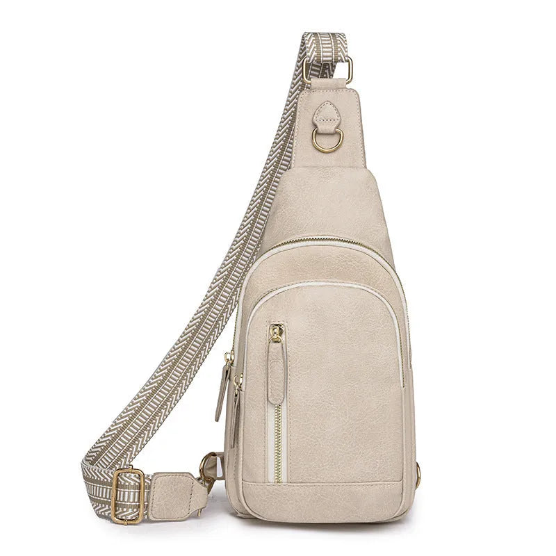Women's soft brown PU crossbody chest bag showing open outer pocket and street style design