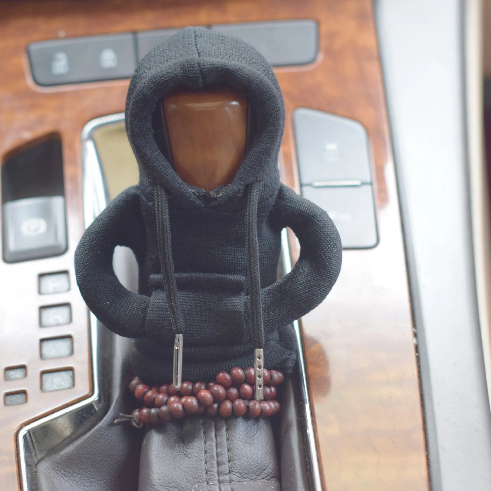 Soft Dutch velvet car gear handle cover in multiple colours on a gear stick.