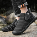 Men's waterproof snow boots in black with thick cotton upper and rubber sole.