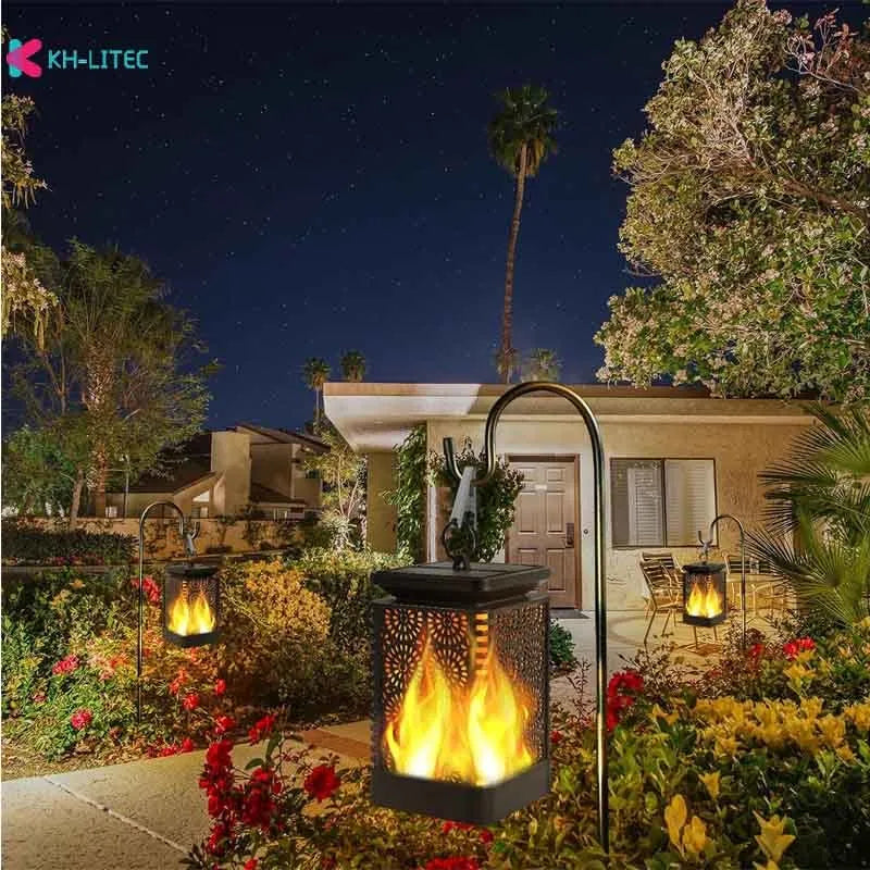 Black solar-powered hanging lantern with flickering LED flame light effect for garden decoration.