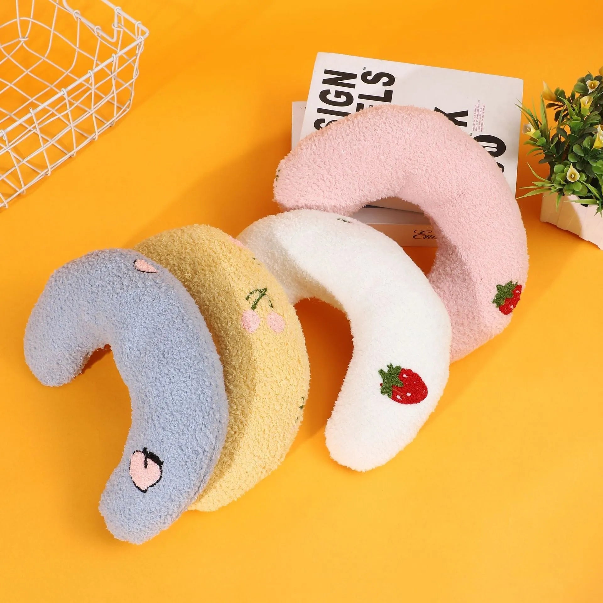 Half moon U-shaped cloth pillow for dogs and cats in blue, pink, white, or yellow