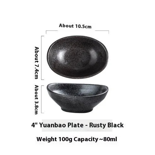 Japanese ceramic oval sauce dipping bowl with traditional underglaze pattern on white background