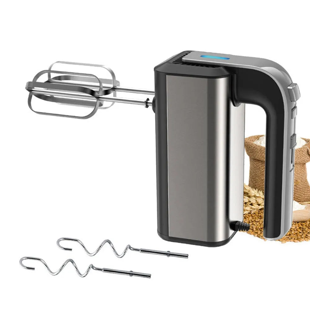 Silver handheld electric kitchen whisk with mixing attachments on counter