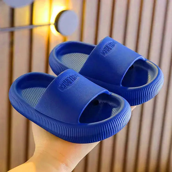 Children's non-slip EVA slippers in bright colours, showing the 1.5cm thick sole.
