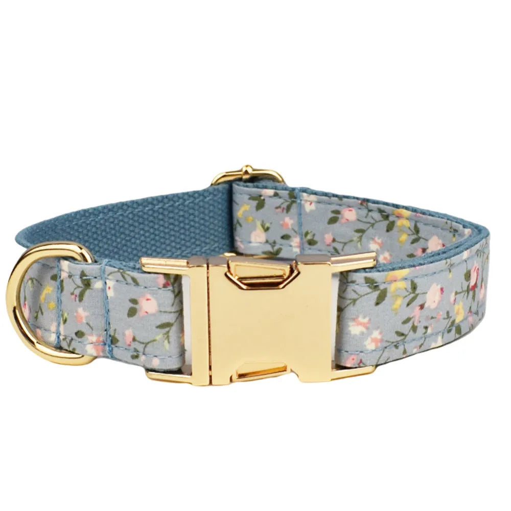 Blue floral polyester cotton dog collar and matching leash set with bow, vest, and poop bag accessories