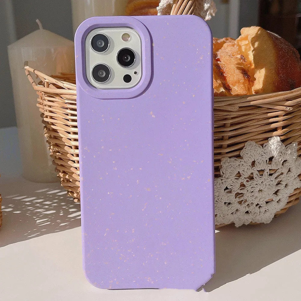 Fully degradable wheat straw bioplastic rear cover case for Apple iPhone on a table, shown in one of seven available colours.