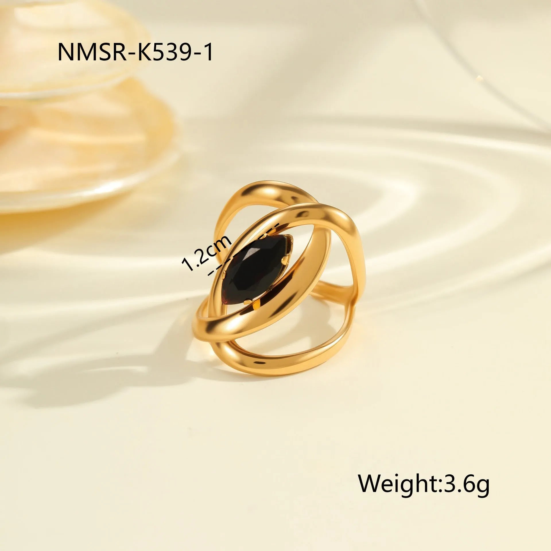 Geometric open mouth titanium steel ring for women on a plain background.