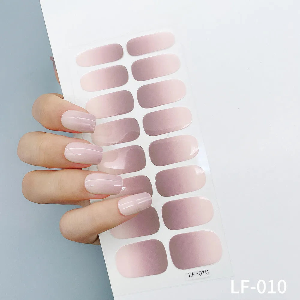 Sheet of 16 solid colour nail art sticker designs including cross, rose, and leopard print patterns.