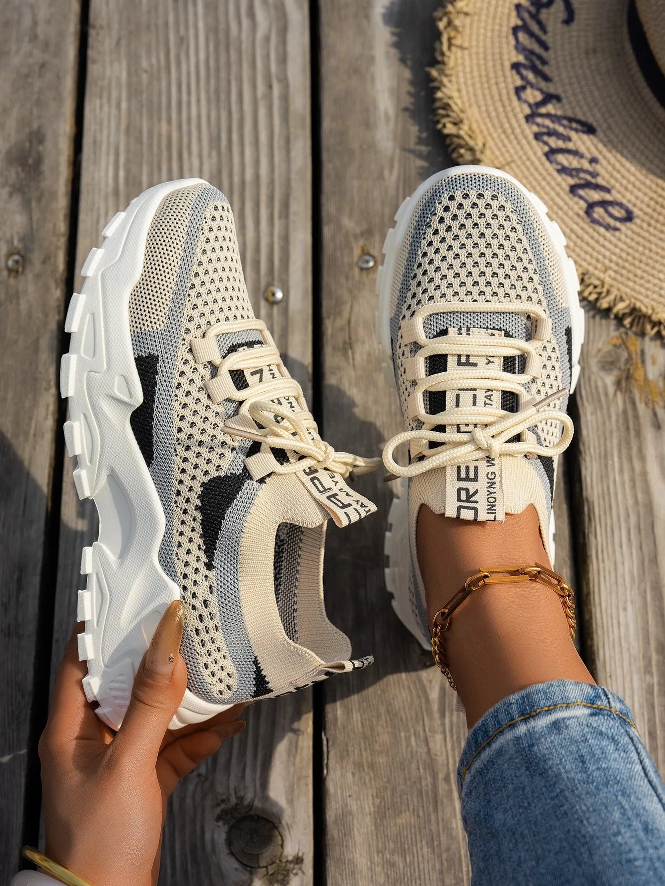 Women's Flyknit mesh lace-up sneakers in multiple colours on a rubber sole.