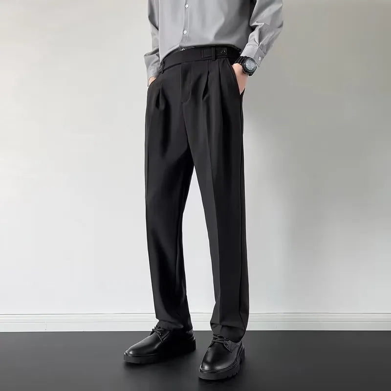 Men's straight cut loose fit suit trousers in apricot and black colours, made from polyester fabric.