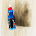 Small blue bottle of 30ml car scratch repair agent with applicator brush for automotive paint touch-ups
