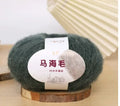 Single ball of mohair yarn in various colours for hand-woven DIY scarf knitting projects