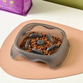 Blue plastic dog slow feeder bowl with anti-choking design for household use
