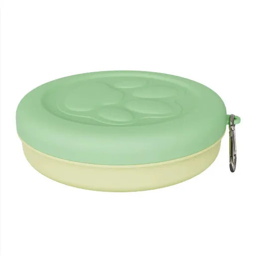 Collapsible silicone dog bowl in light pink and green colours showing portable feeding design