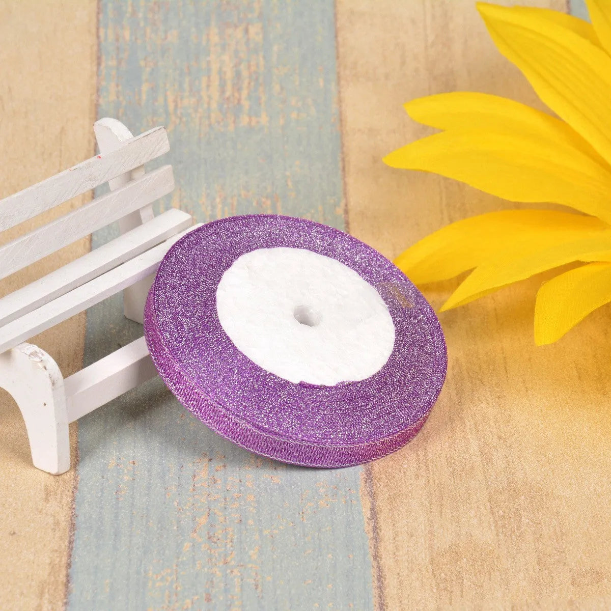 Polyester ribbon spool in metallic colours for decorative clothing and gift packaging trim
