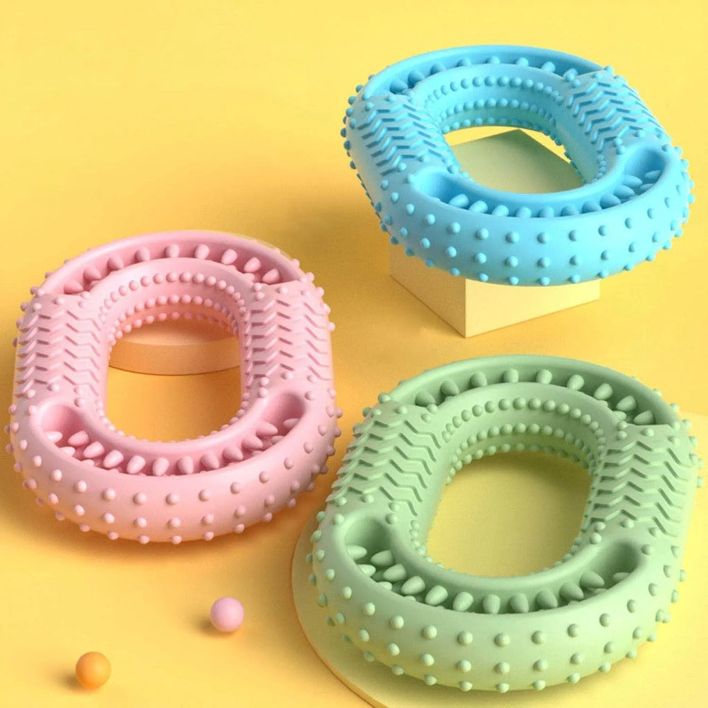 Blue O-ring shaped dog chew toy for aggressive chewers on a plain background.