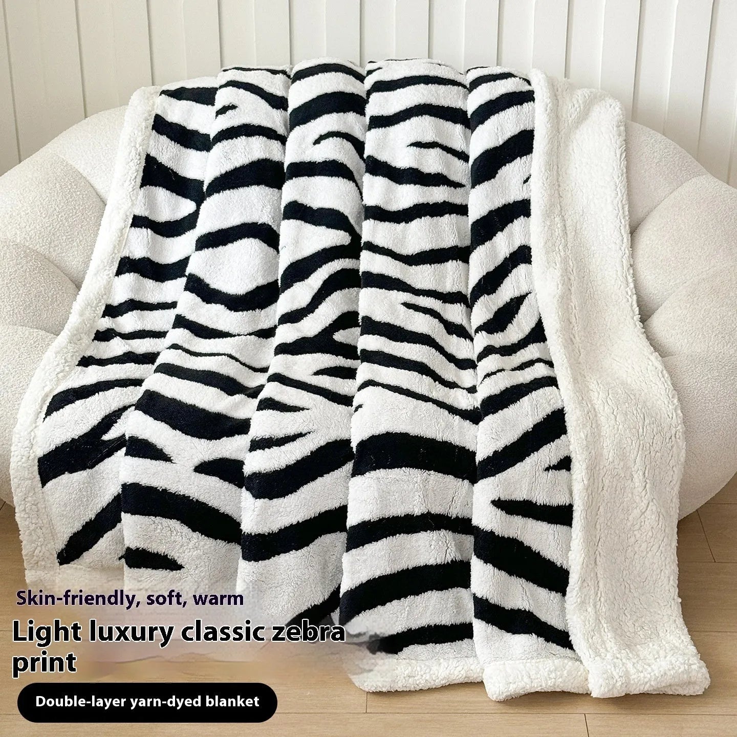 Double-layer Jacquard taffeta blanket with leopard print design in camel colour folded to show texture and pattern detail