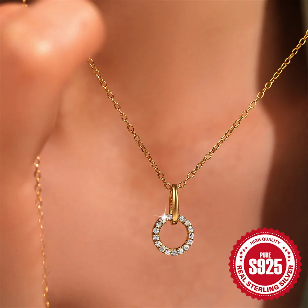 Gold colour sterling silver clavique chain necklace with interlocking zircon design on model