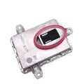Metal headlight ballast unit for automotive use, showing scale with dimensions 14x11x4.5cm