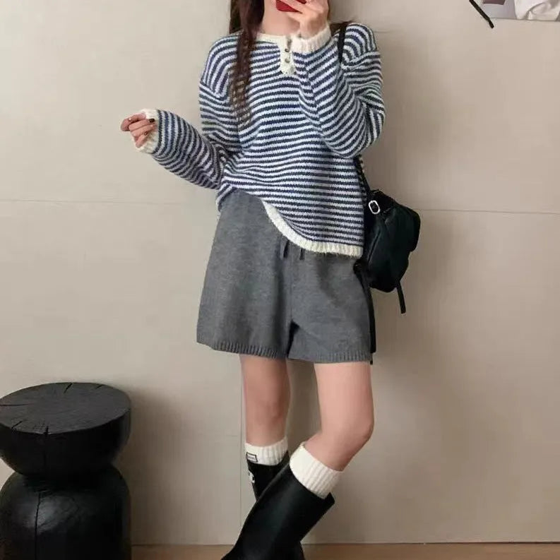 Red and blue striped cashmere pullover sweater for women with loose fit and long sleeves.