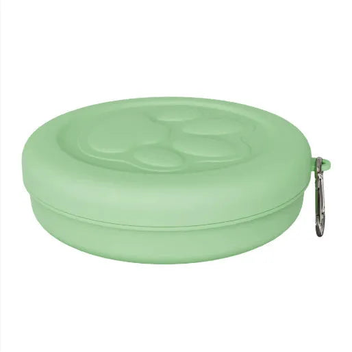 Collapsible silicone dog bowl in light pink and green colours showing portable feeding design