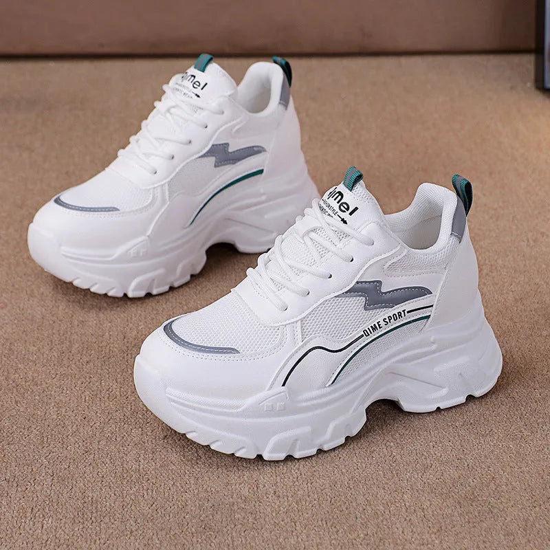 Beige women's lace-up dad shoes with cross straps and a round toe, on a white background.