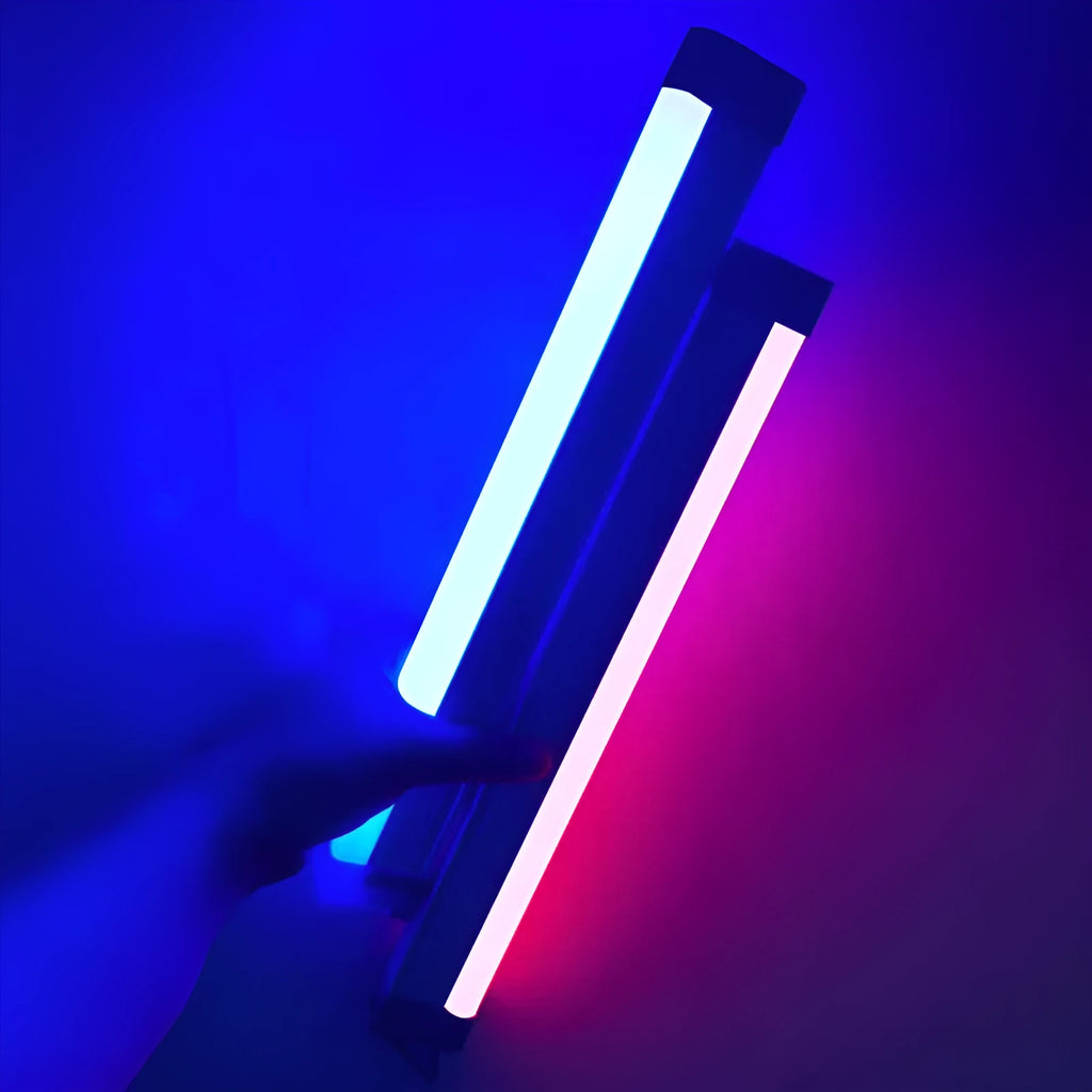 Blue and purple rechargeable LED tube light with USB cable on a dark background.