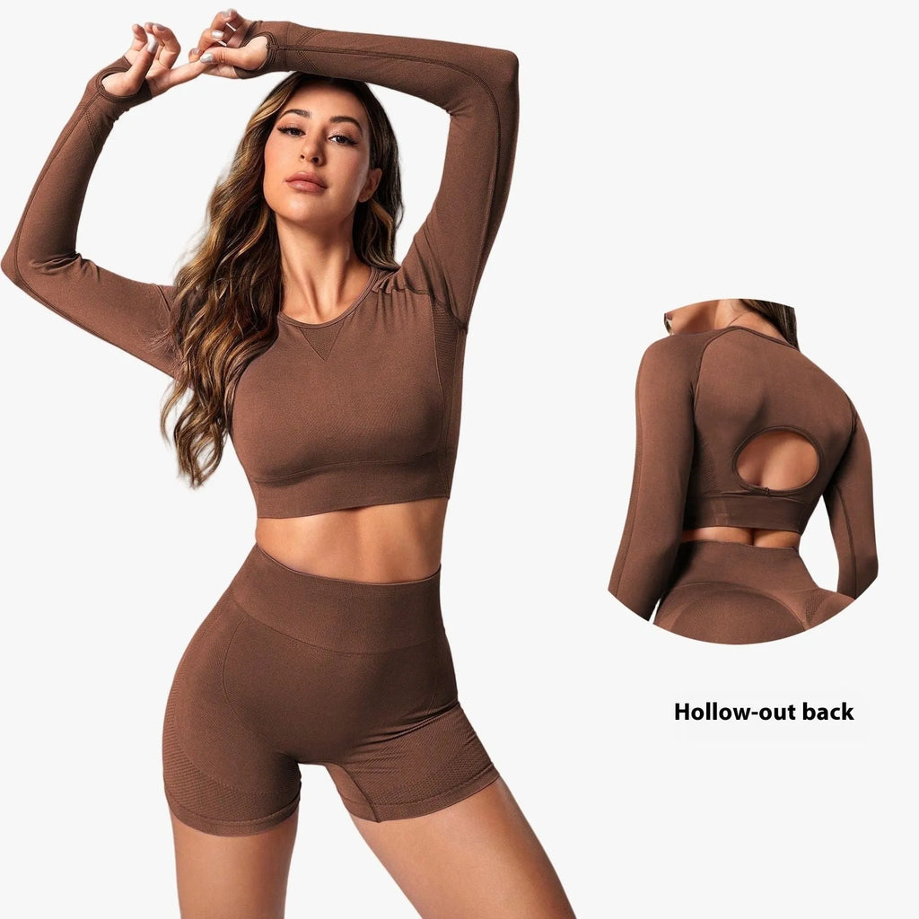 Women's black high waist yoga suit with long sleeve top and tight-fitting trousers on a mannequin.