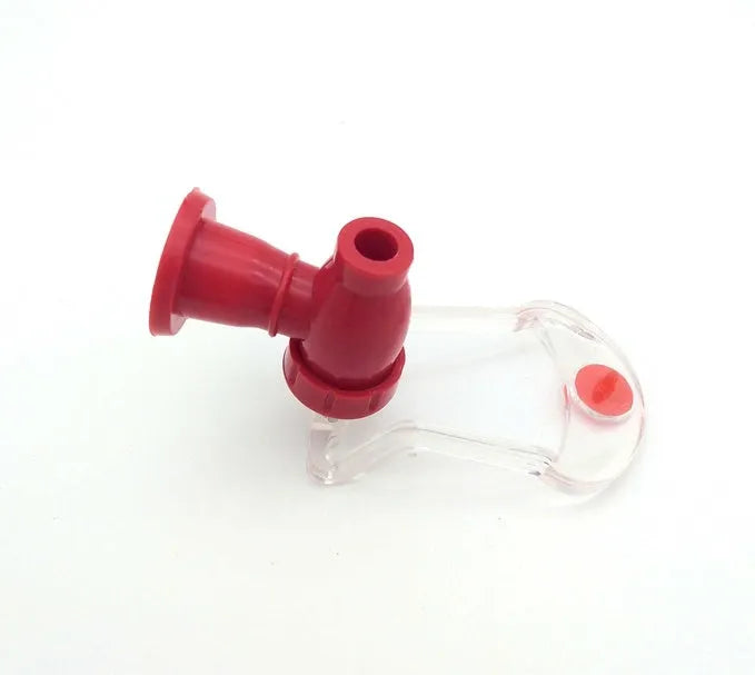 Red plastic soda dispenser attached to inverted 2-litre bottle for push-button drink serving