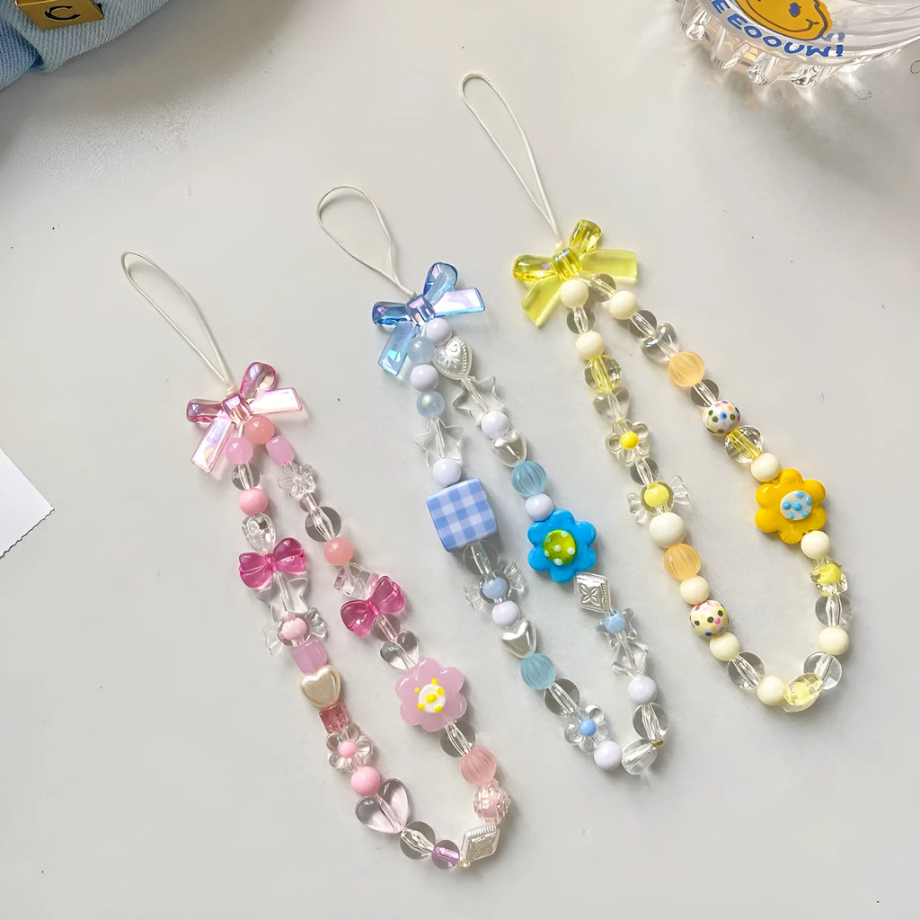 Beaded flower mobile phone lanyard in blue, pink, and yellow colour options