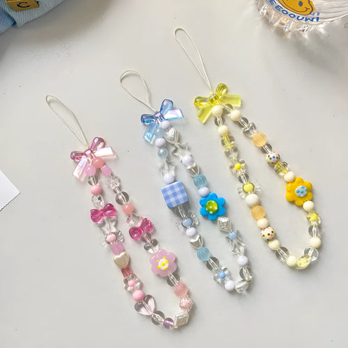 Beaded flower mobile phone lanyard in blue, pink, and yellow colour options