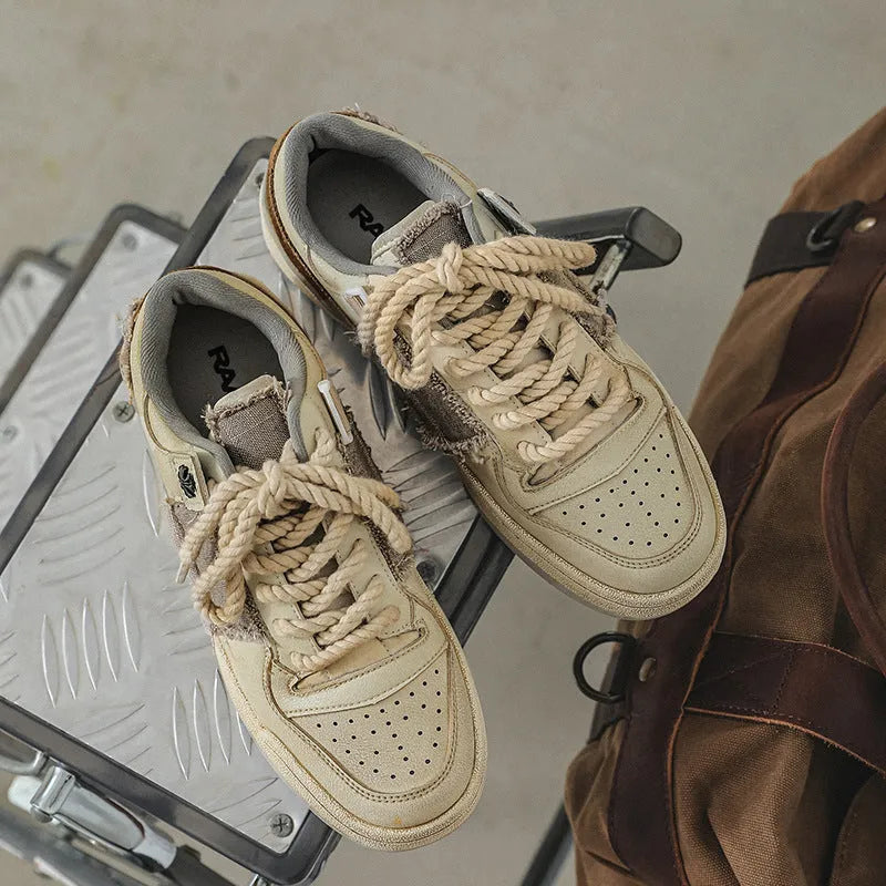 Beige vintage style low-top skateboard shoes with round toe and lace-up front