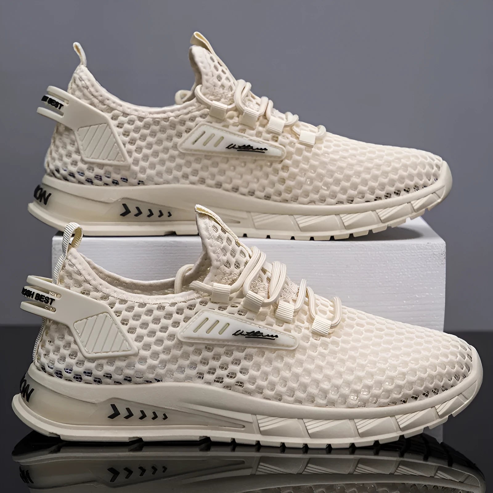 Men's beige casual sneakers with mesh lining, synthetic leather upper, and lace-up front closure