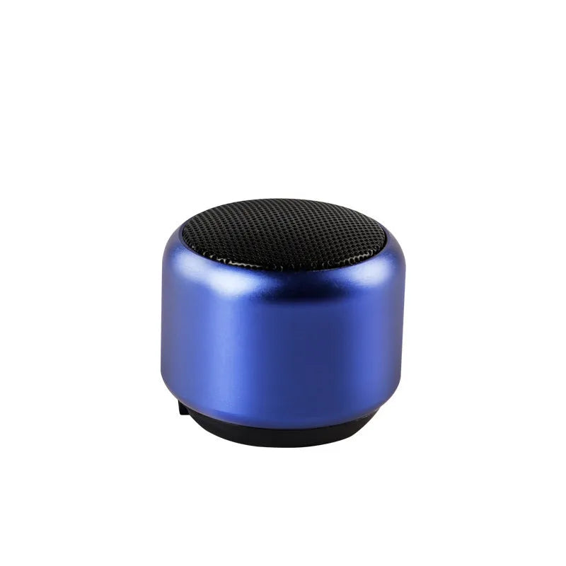 A compact portable Bluetooth mini speaker in black, blue, gold, or pink colour.