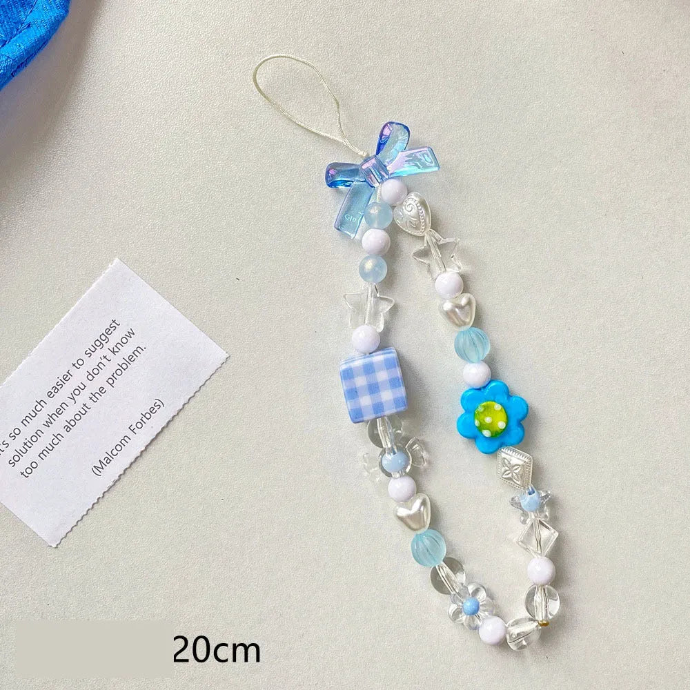 Beaded flower mobile phone lanyard in blue, pink, and yellow colour options