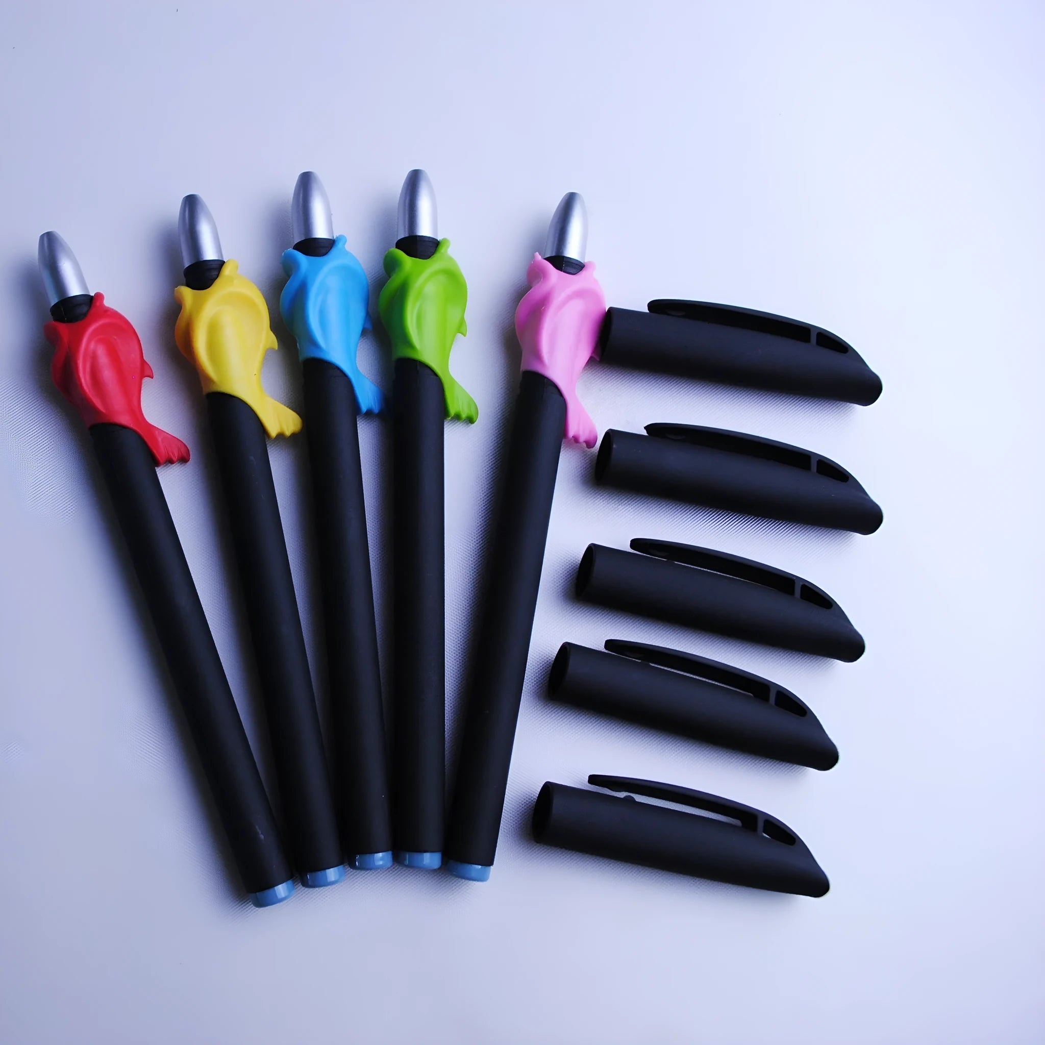 Automatic fading pen set with blue 0.5mm refills and pen holder on white background.