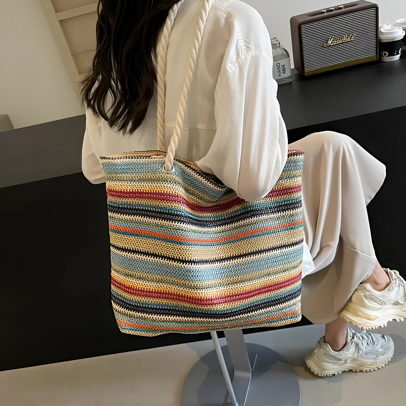 Blue straw woven large capacity nylon shoulder bag with a single strap.